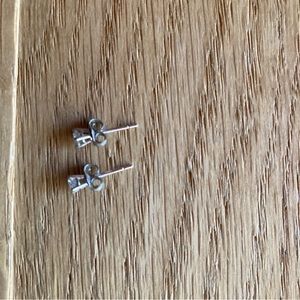 Diamond stud earrings set in sterling silver